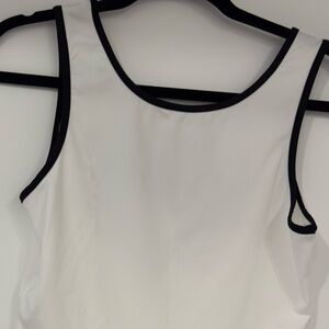 White Sleeveless Top with Black Trim